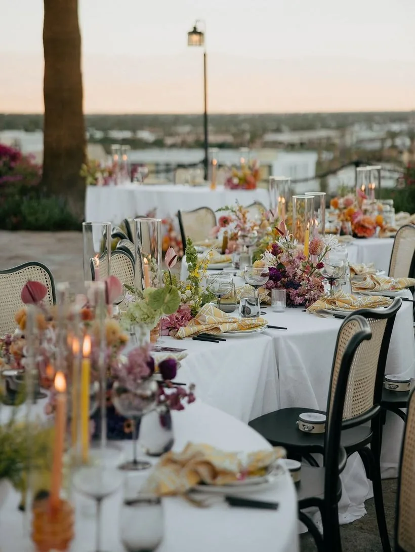 Rooftop reception at dusk with florals and candlelight