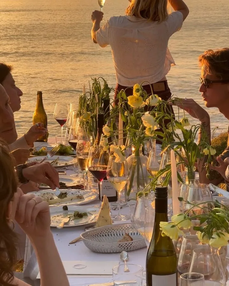 Golden hour oceanfront lunch mid service